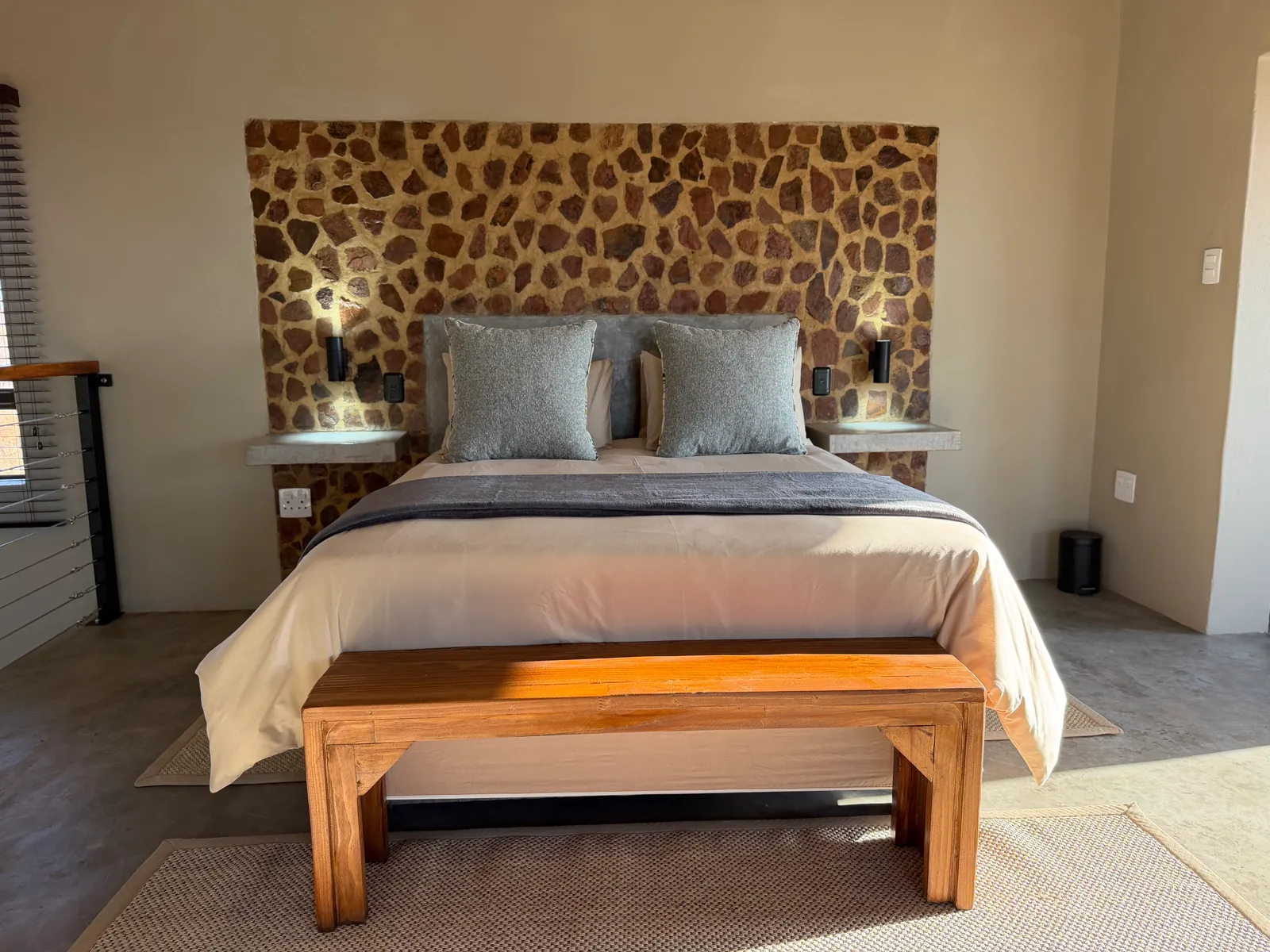 Main bedroom with stone feature wall